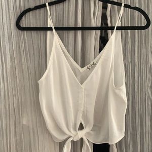 Cute flowy white cropped tank from Free People. Perfect for spring/summer!